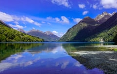 Clear blue sky on Mirror Lake, Milford Sound, New Zealand 