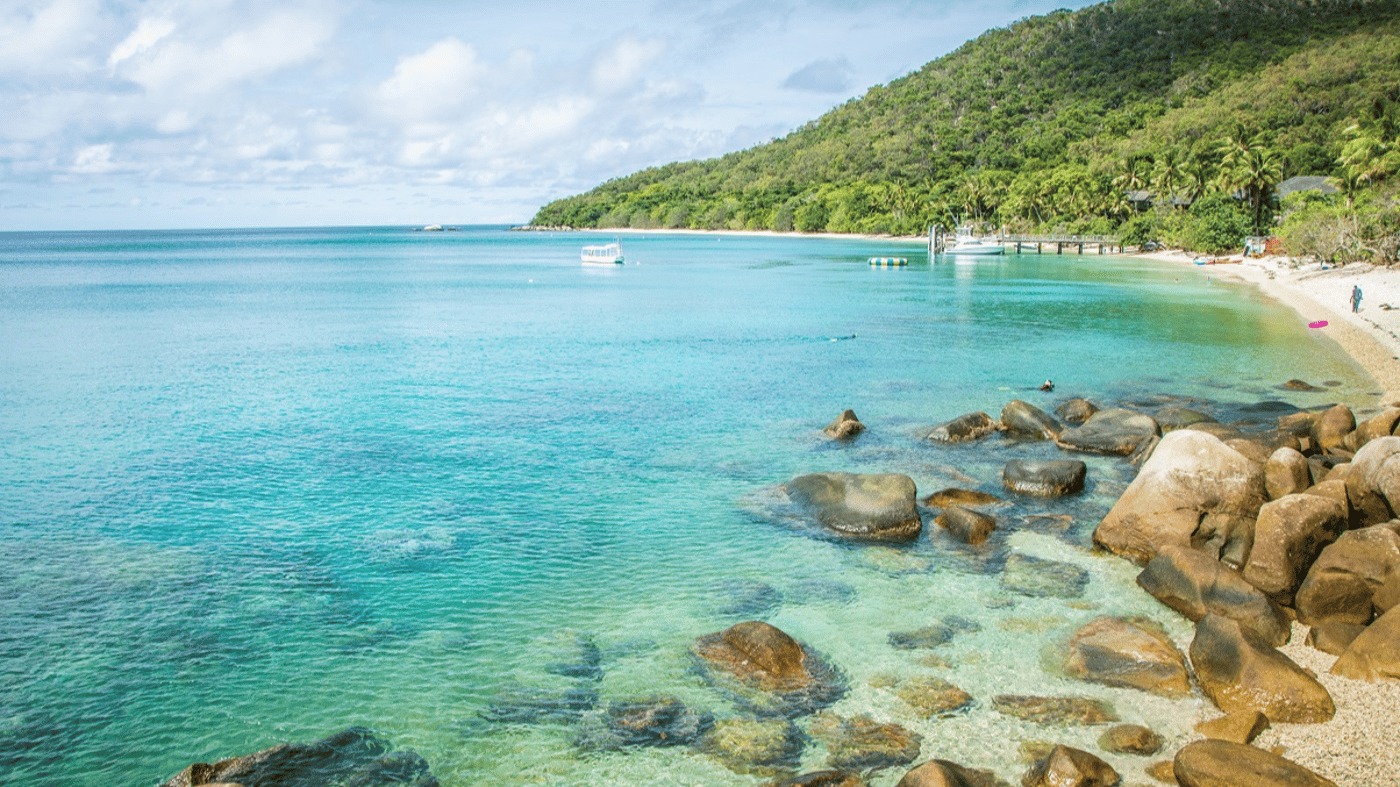 Step out from the resort to Welcome Bay with all its life and activity