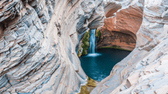 The startling landscape of spectacular gorges, waterfalls and rock pools provides a striking contrast to the stark red landscape of the Pilbara