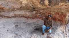 Join a Traditional Owner guide to view the remarkable Aboriginal rock art on Stanley Island