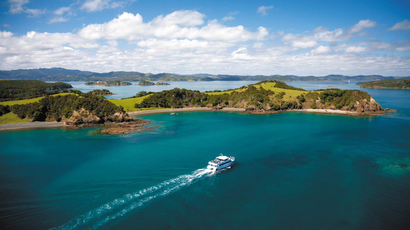 Explore the scenic beauty of the Bay of Islands aboard a luxury catamaran