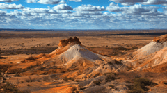 Travel through salt-lake country to isolated Coober Pedy, regarded by many as the opal capital of the world