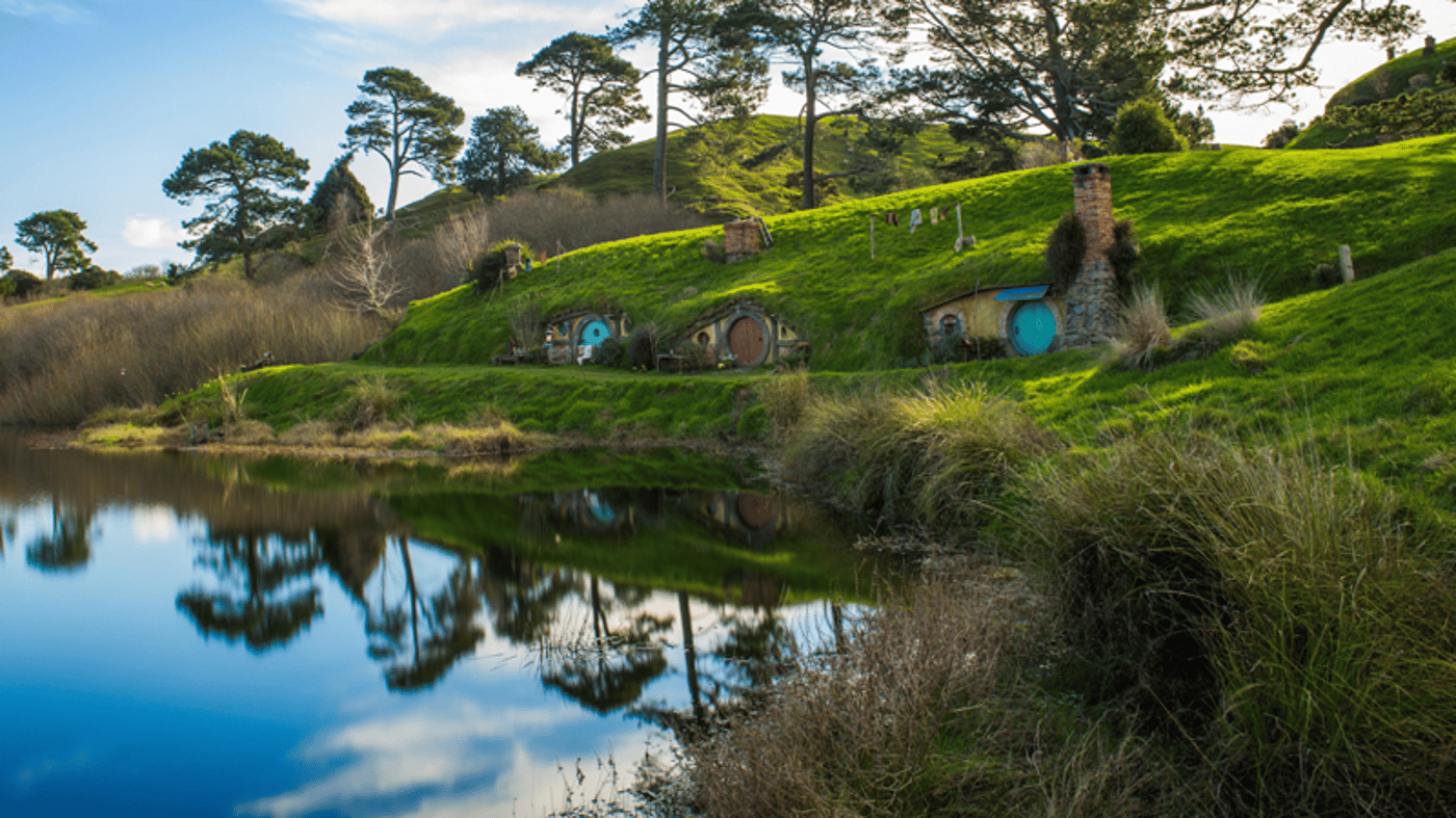 Experience the iconic rolling hills and green pastures of the Hobbiton Movie Set