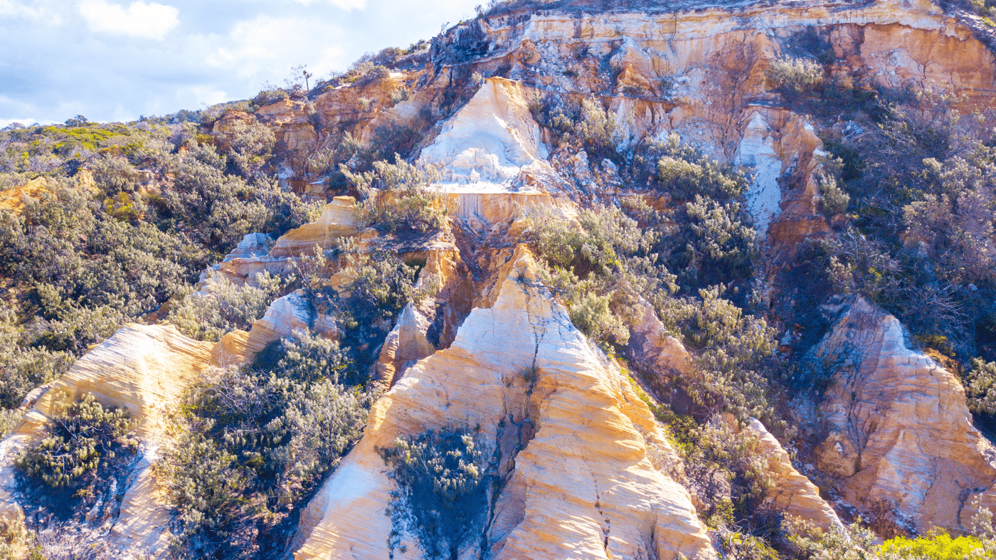 Marvel at The Coloured Sands of the Pinnacles