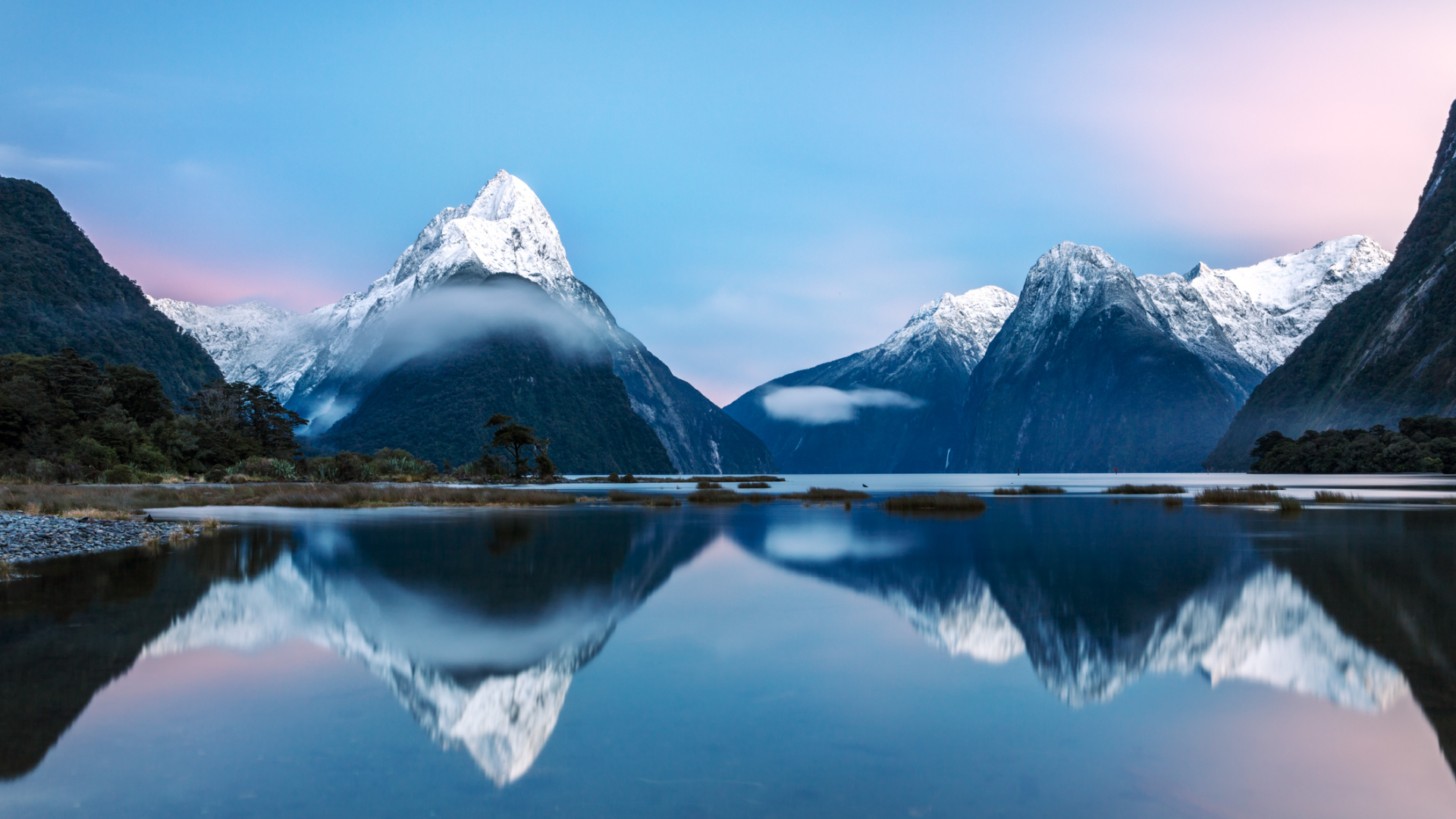 Awesome sunrise over Mitre peak and mountains of Milford Sound, Fiordland National Park, Southland, New Zealand