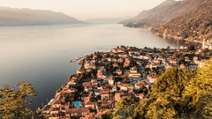 Lake Maggiore, a tranquil resort area with crystal clear waters set against the backdrop of the Alps