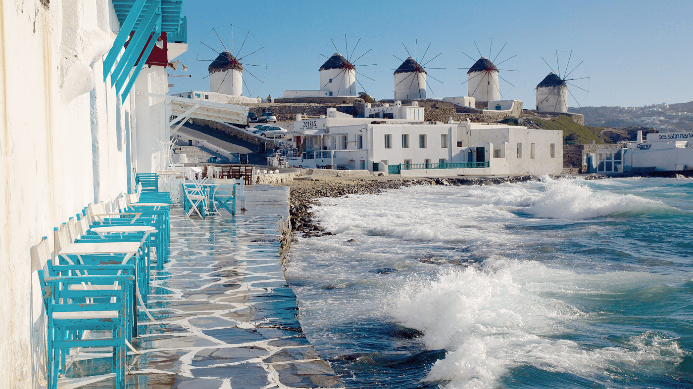 Wander through the narrow, winding streets of Mykonos with its whitewashed houses, flowers and brightly painted shutters and doors.