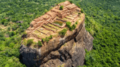 Aerial view from above of Sigiriya or the Lion Rock, an ancient fortress and a palace with gardens, pools, and terraces atop of granite rock in Dambulla, Sri Lanka.