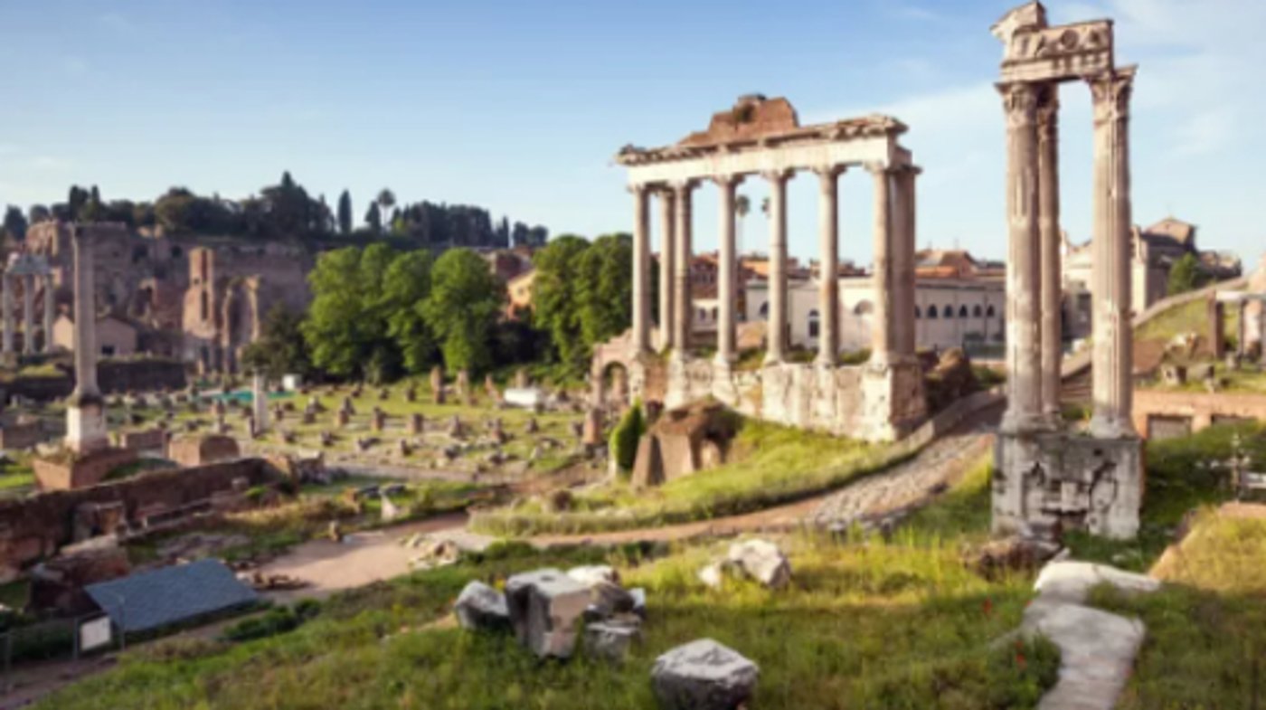 Rome - The Temple of Saturn (foreground) and the Arch of Septimius Severus in the Roman Forum.