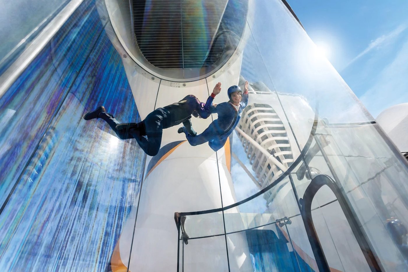 Guest experiencing the RipCord by iFLY skydiving simulator aboard Ovation of the Seas.